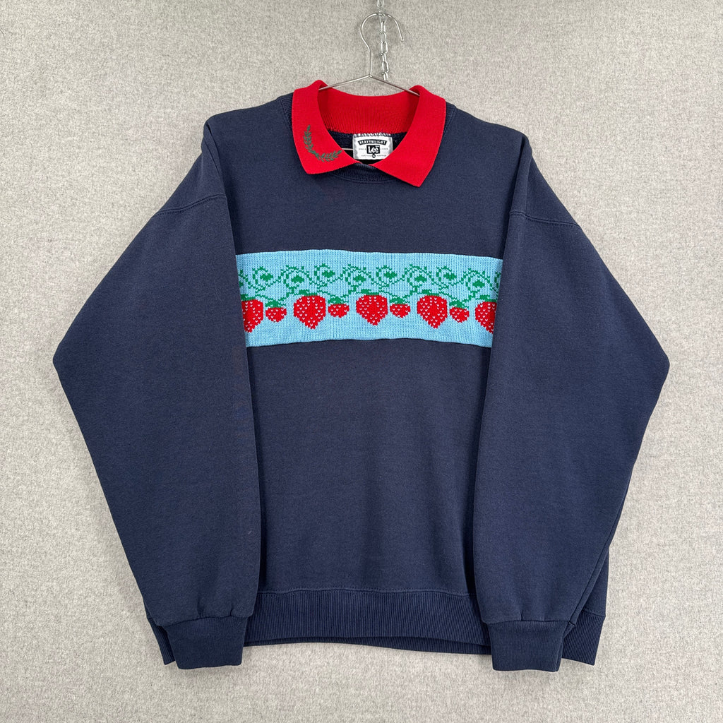 Navy blue shirt with red and white pattern on a light gray background