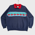 Navy blue sweatshirt with a colorful strawberry pattern on a gray surface