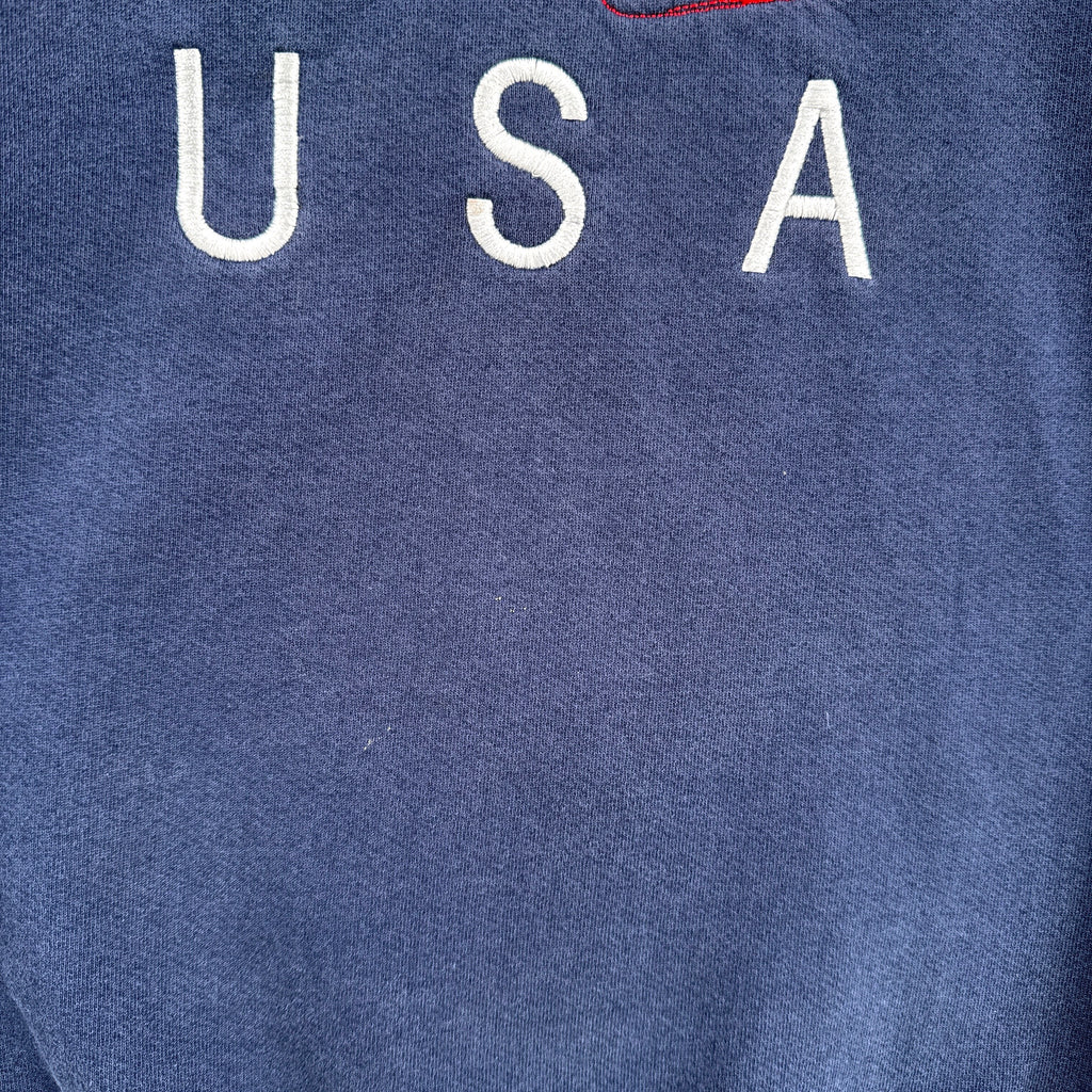 Blue sweatshirt with 'USA' text on a blue background. slight discolouration under logo