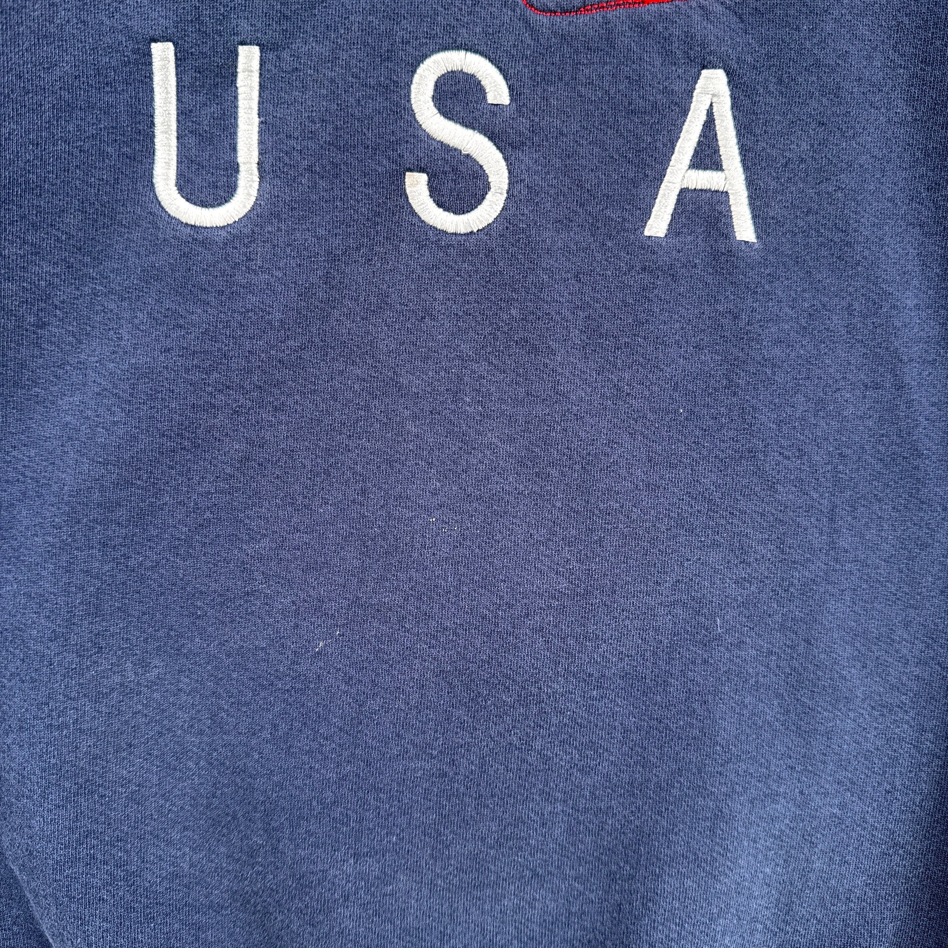 Blue sweatshirt with 'USA' text on a blue background. slight discolouration under logo