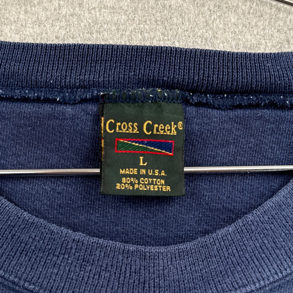 Blue garment with a Cross Creek label on a gray background. size Large made in USA 80% cotton 20% polyester