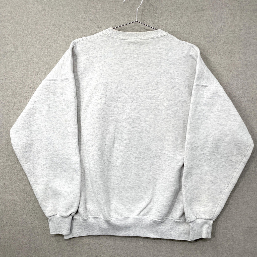 Gray sweatshirt on a hanger against a gray background