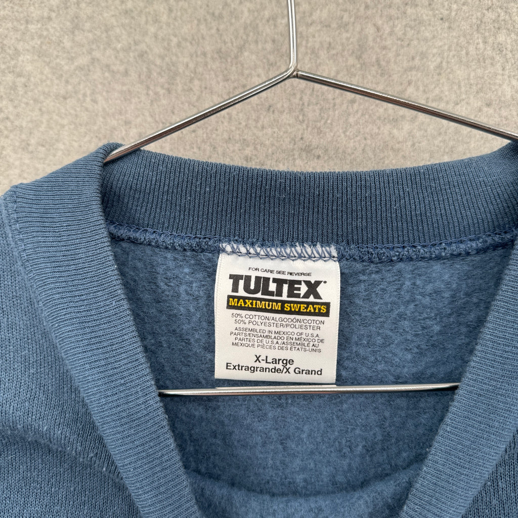 Blue sweater with Tultex label on a hanger. XL 50% cotton 50% polyester