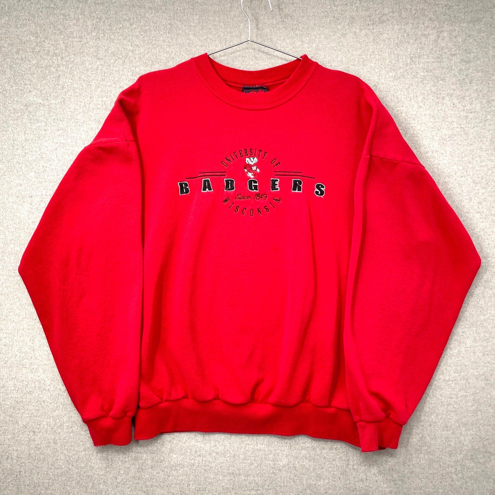 Red sweatshirt with 'University of Badgers' text on a gray background