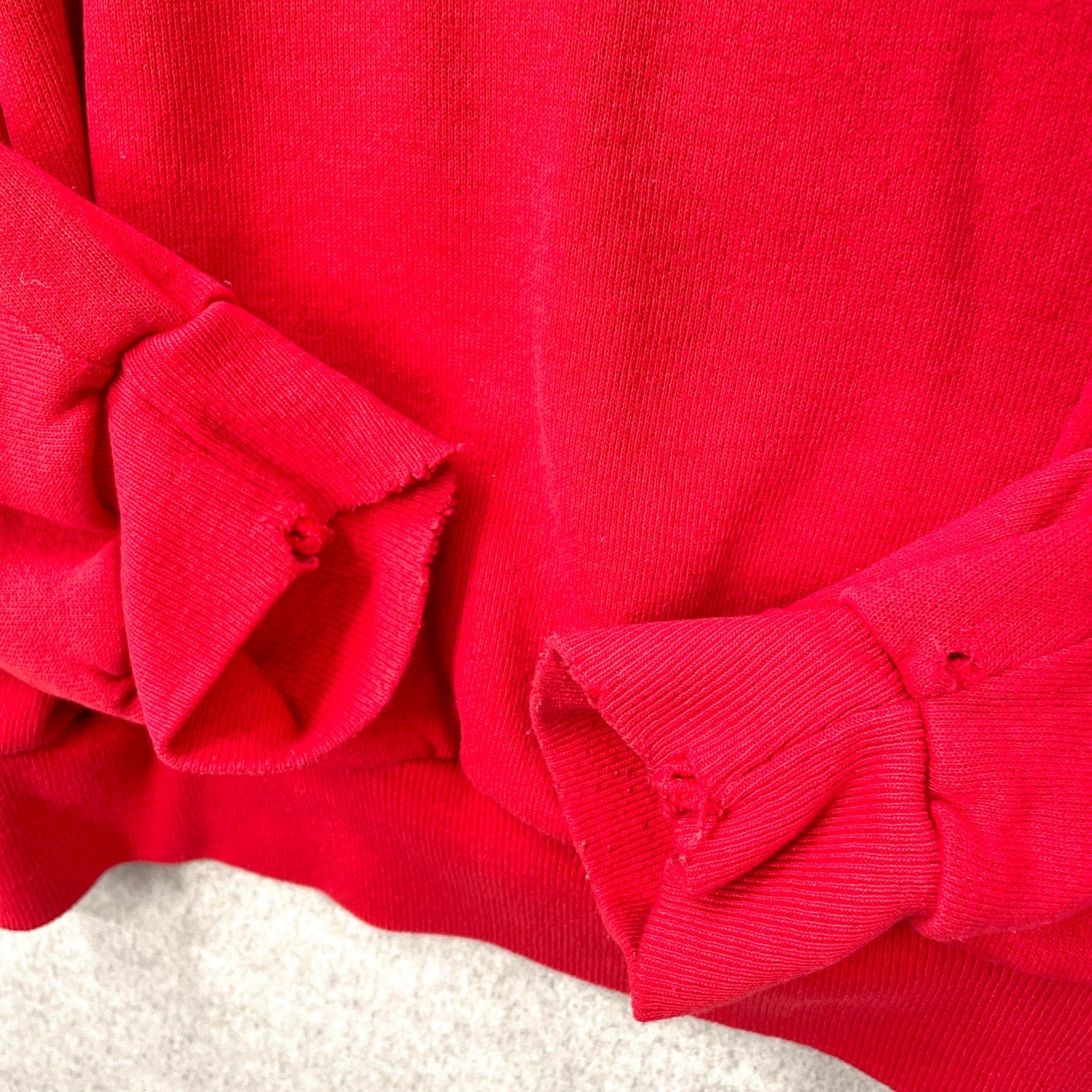 sleeves with rips and fraying
