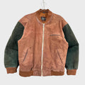Two-tone brown and green jacket on a hanger against a light gray background