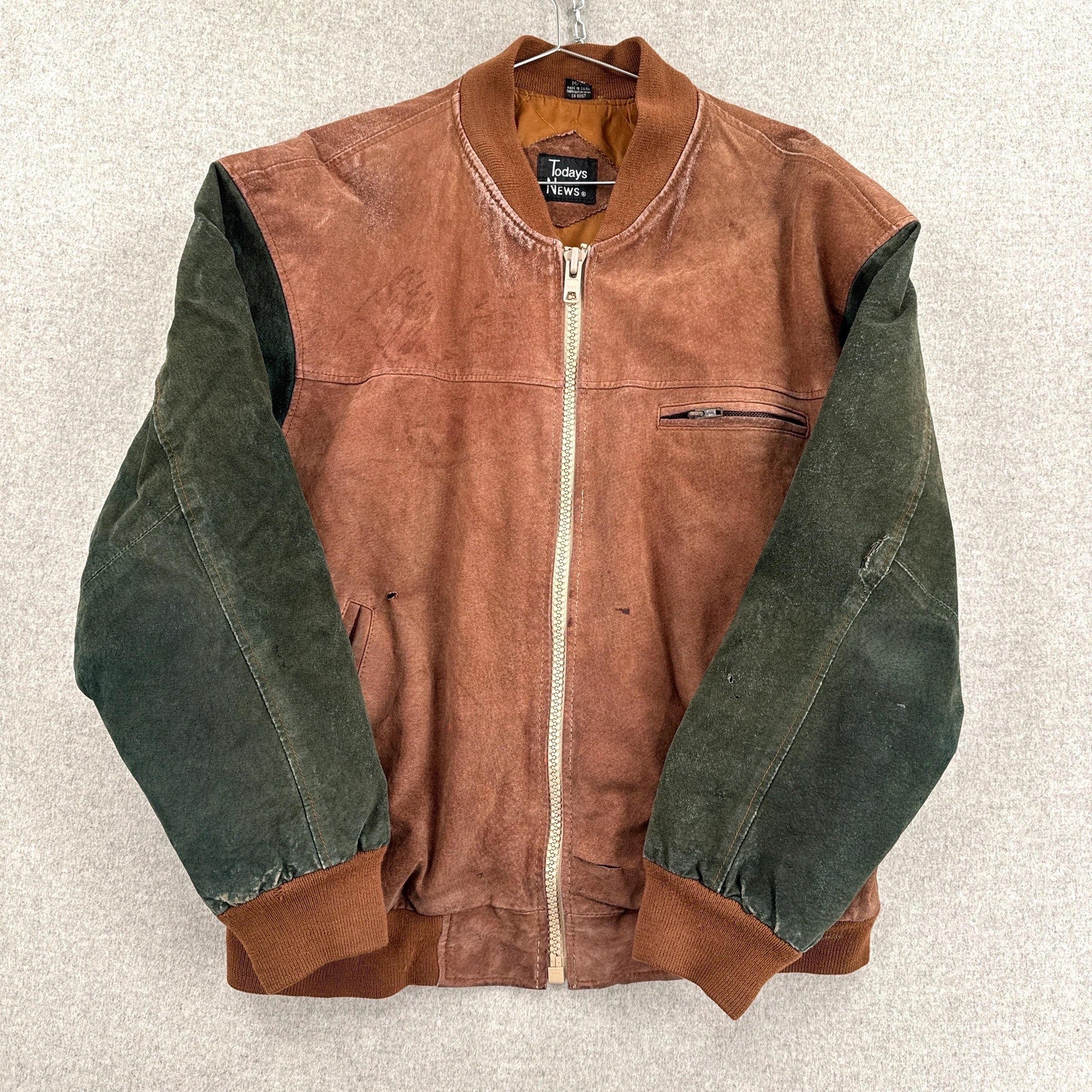 Brown and green jacket on a light gray background