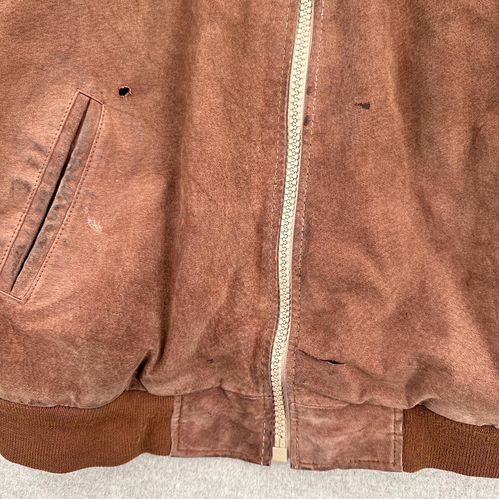 rips and stains on front of jacket