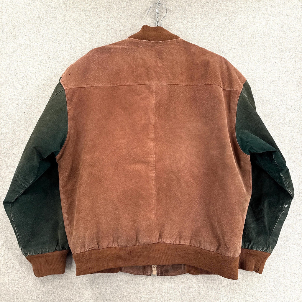 Brown and green jacket on a hanger against a white background