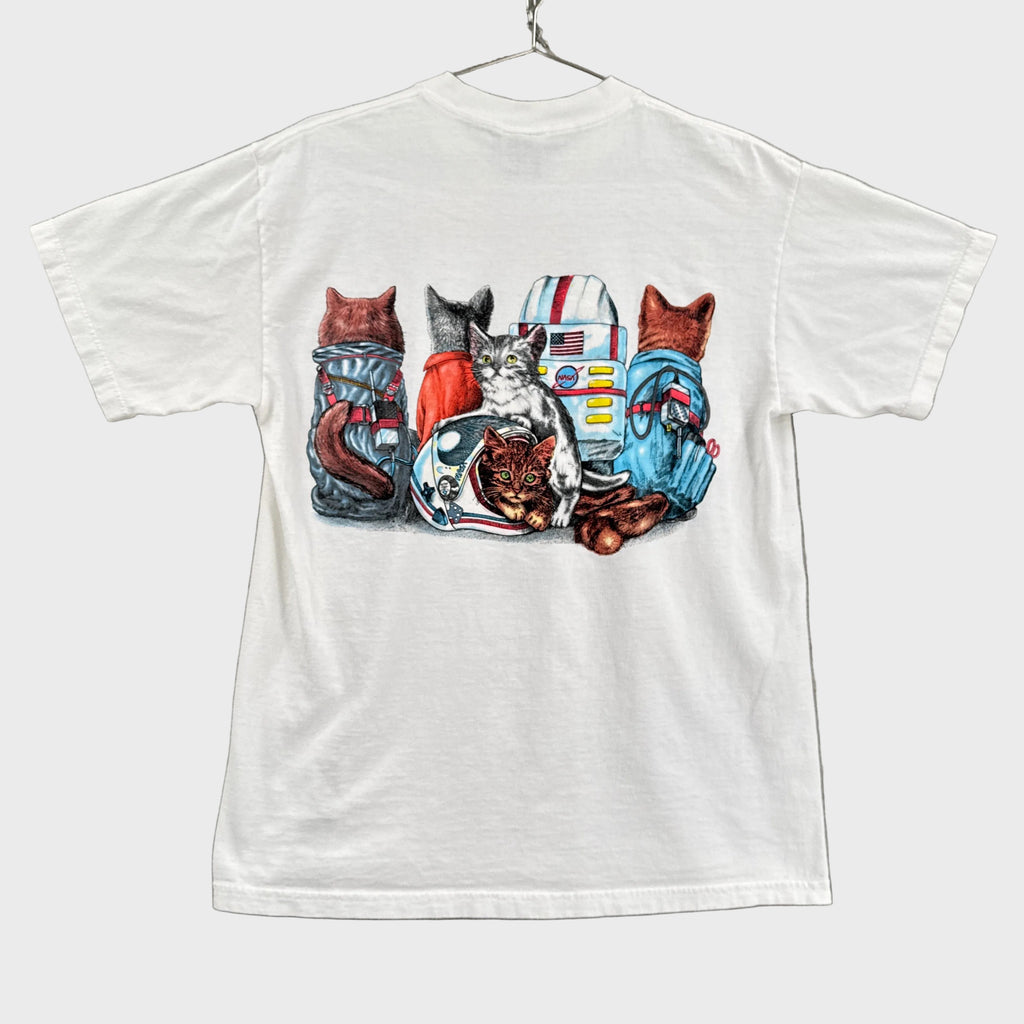 White t-shirt with a colorful graphic design on a gray background