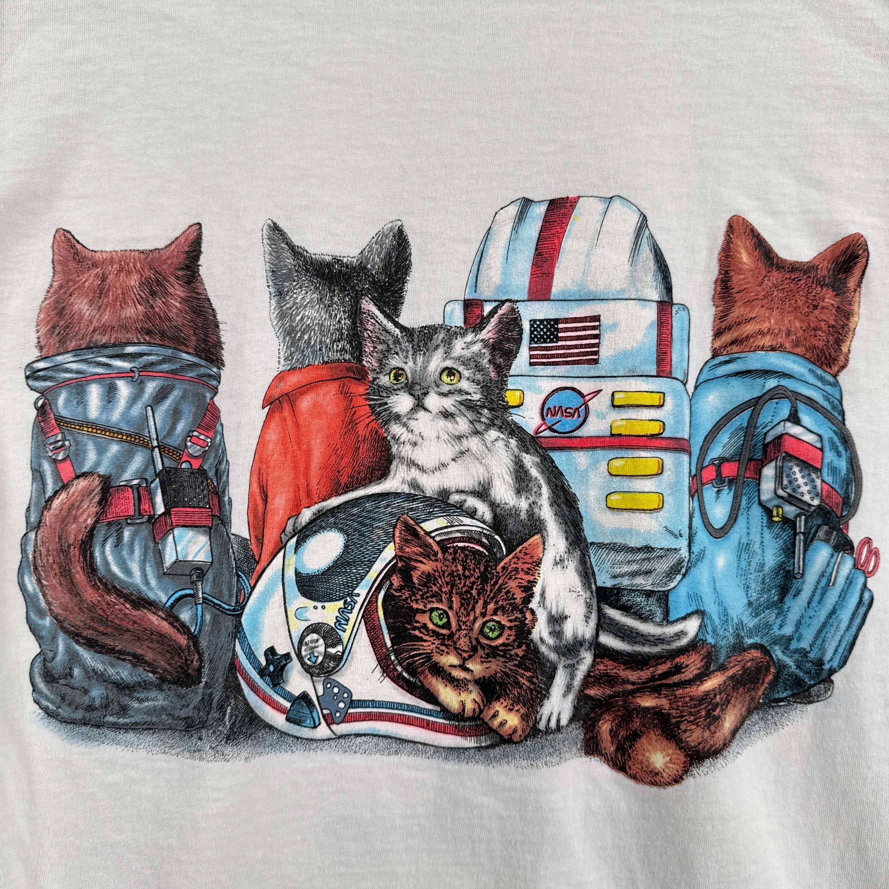 Illustration of cats in astronaut suits on a white background