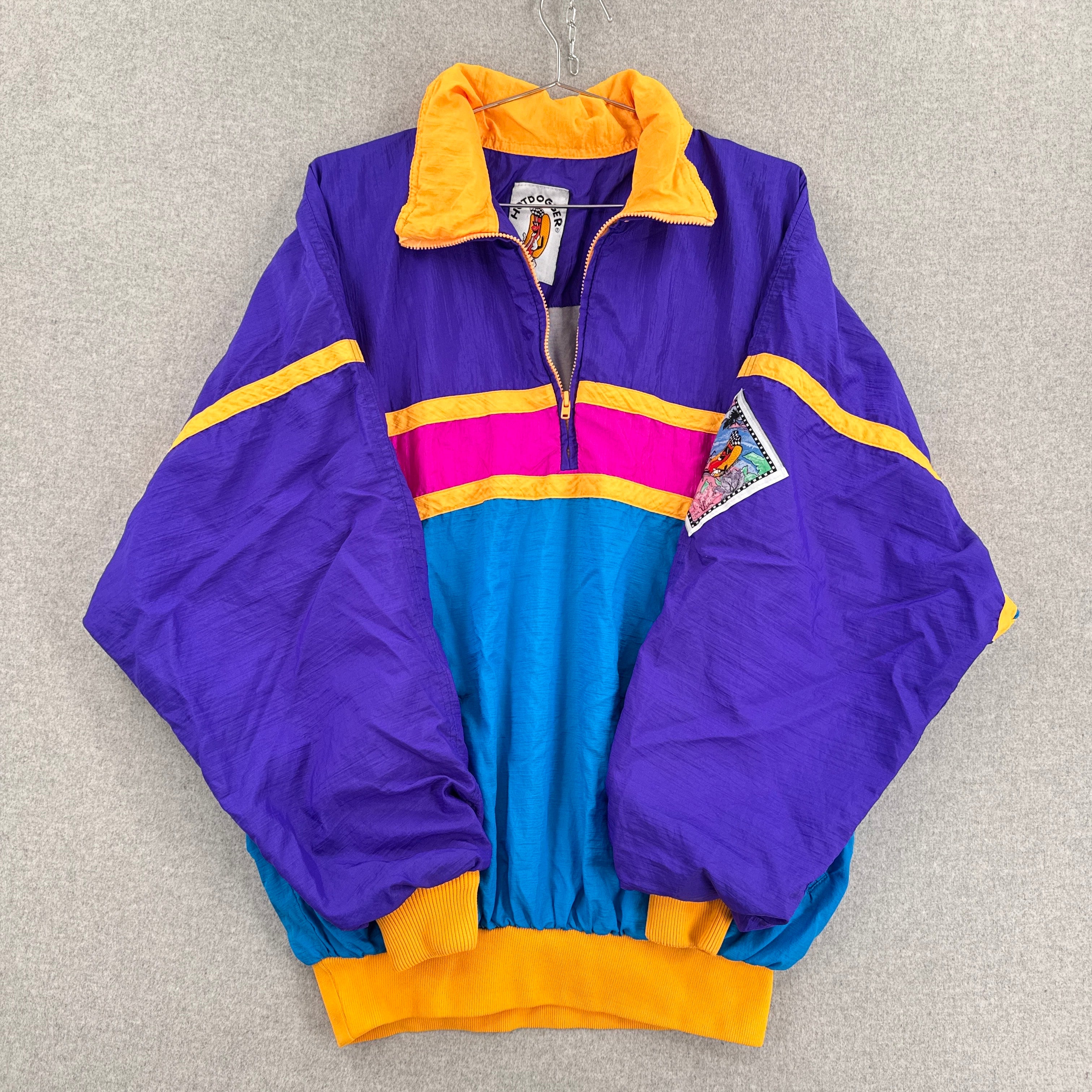 Colorful jacket with purple, blue, pink, and yellow accents on a gray background