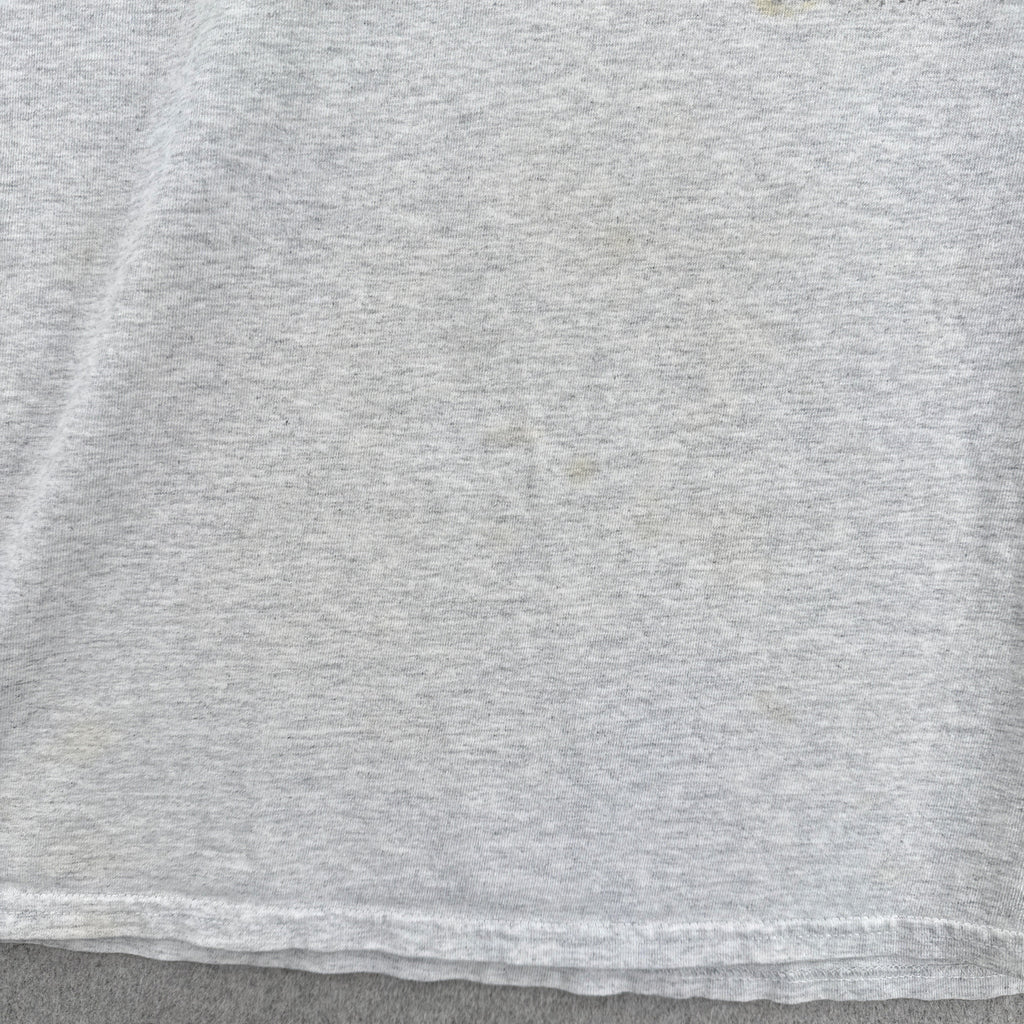 some faint stain spots on the front of the shirt
