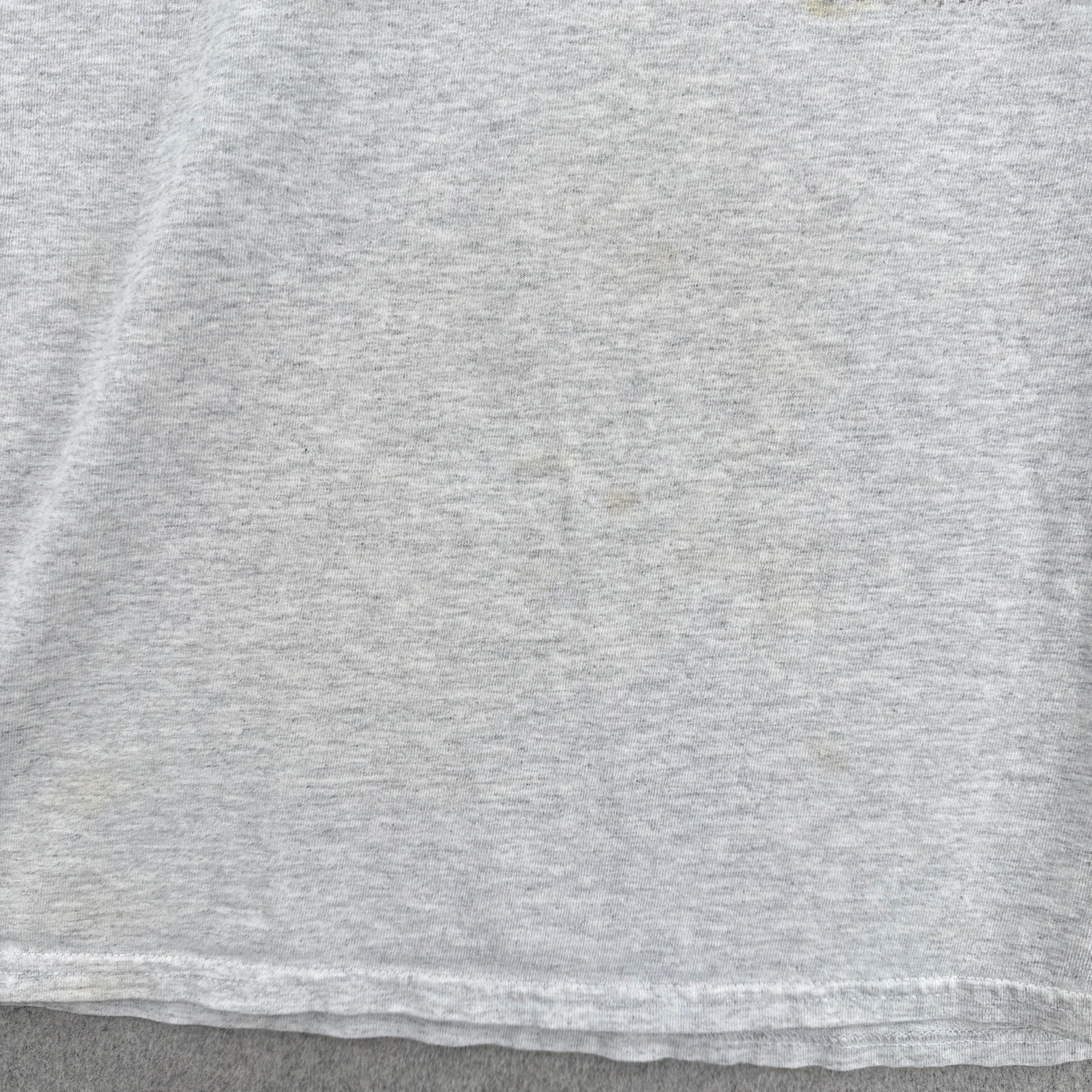 some faint stain spots on the front of the shirt