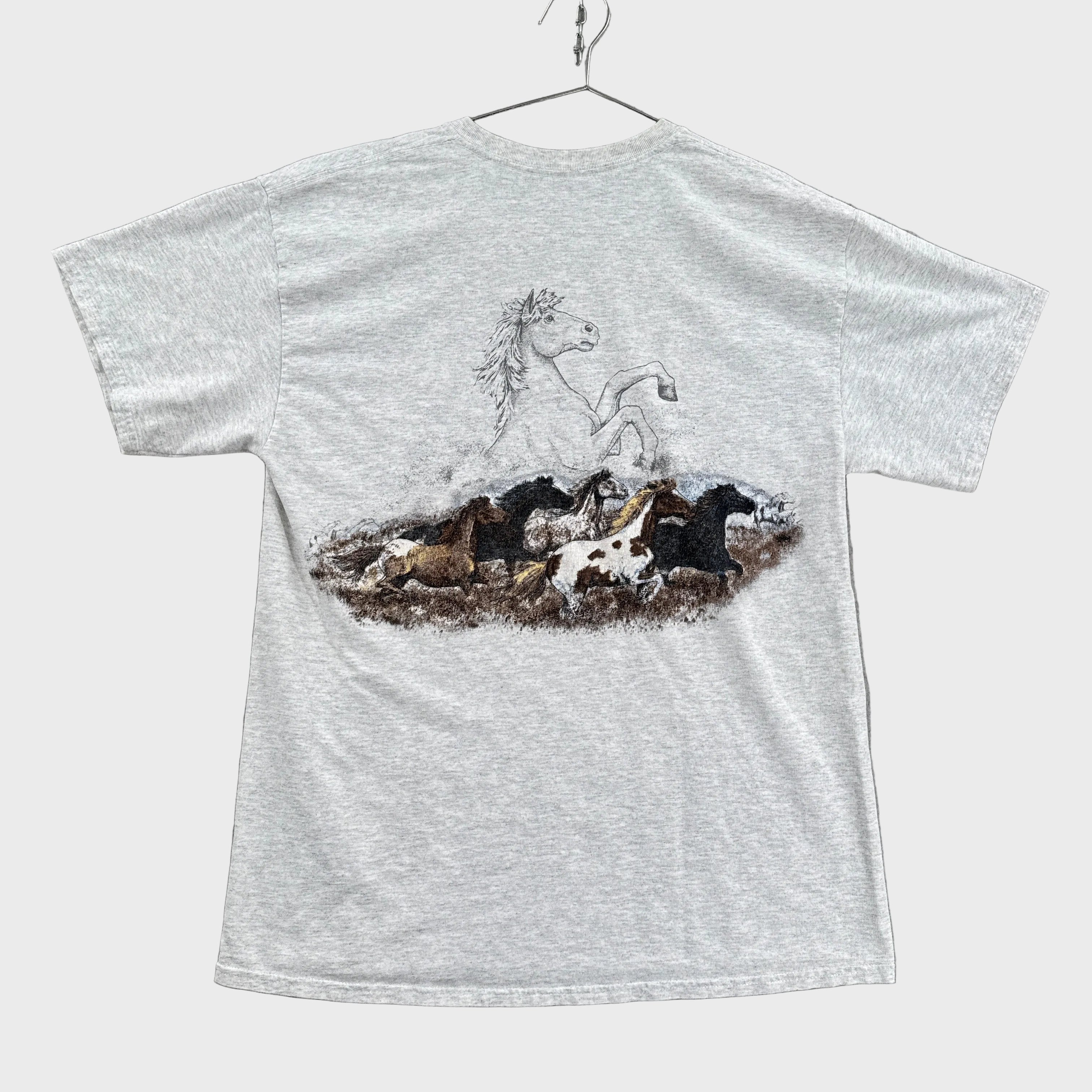 Gray shirt with a graphic design of a horses running on the back