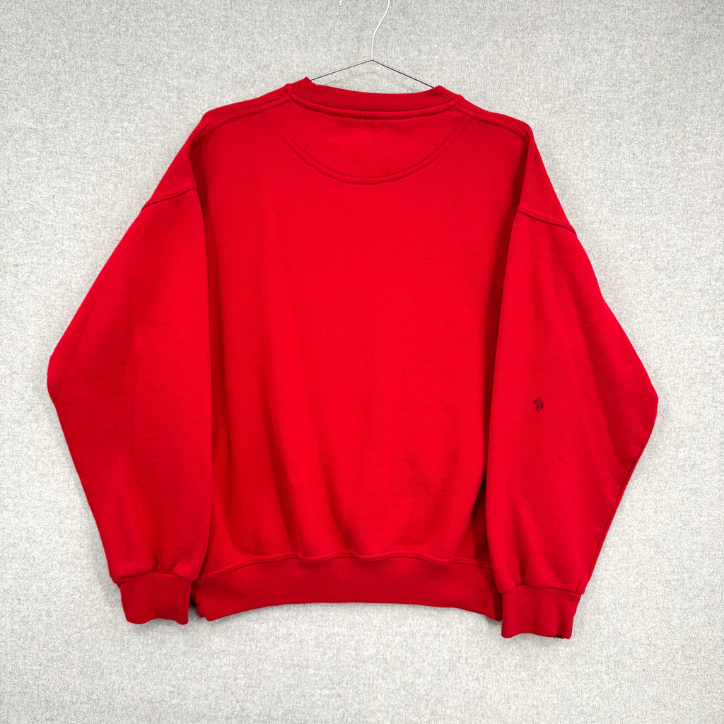 Red sweatshirt on a hanger against a gray background