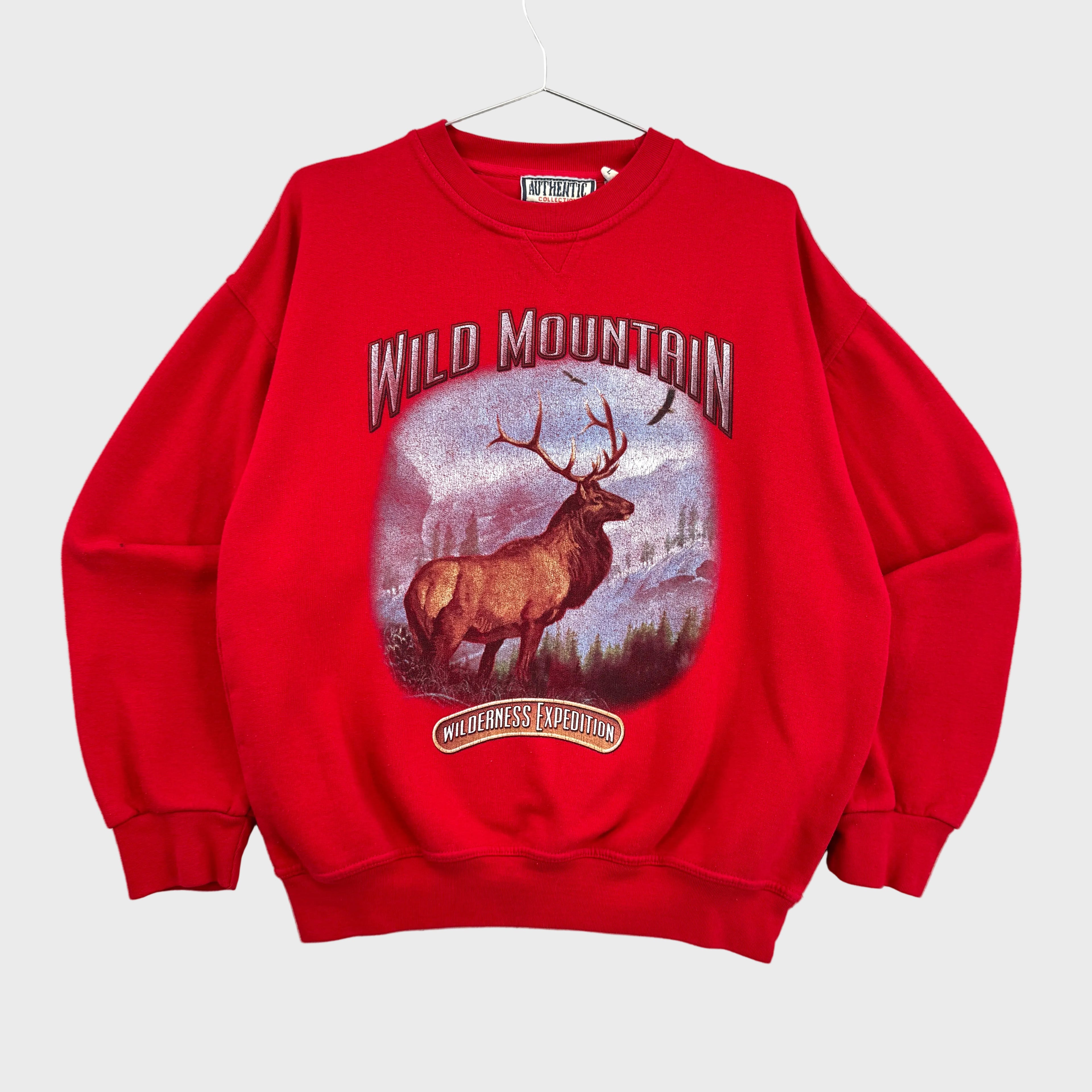 Red sweatshirt with a graphic of an elk and 'Wild Mountain' text on a gray background