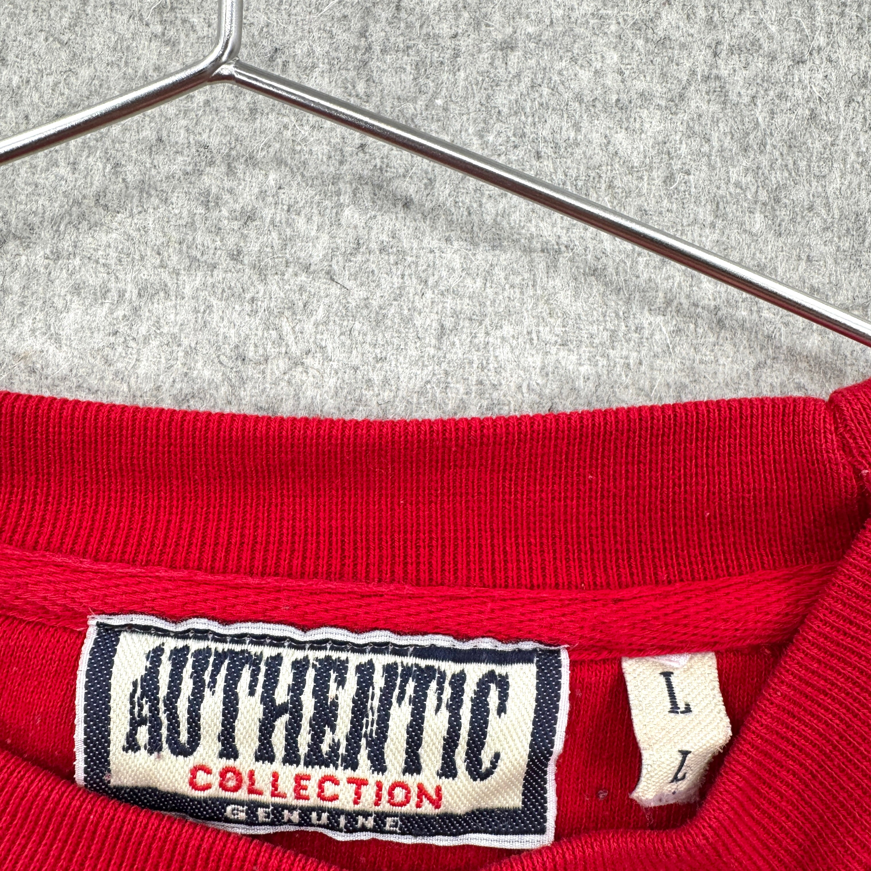 Red garment with 'Authentic Collection' label on a hanger, size Large