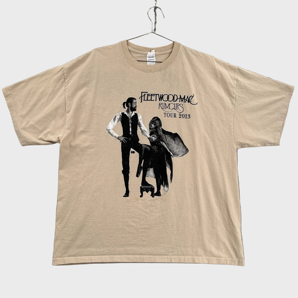 Beige t-shirt with Fleetwood Mac Rumours tour graphic on a gray background