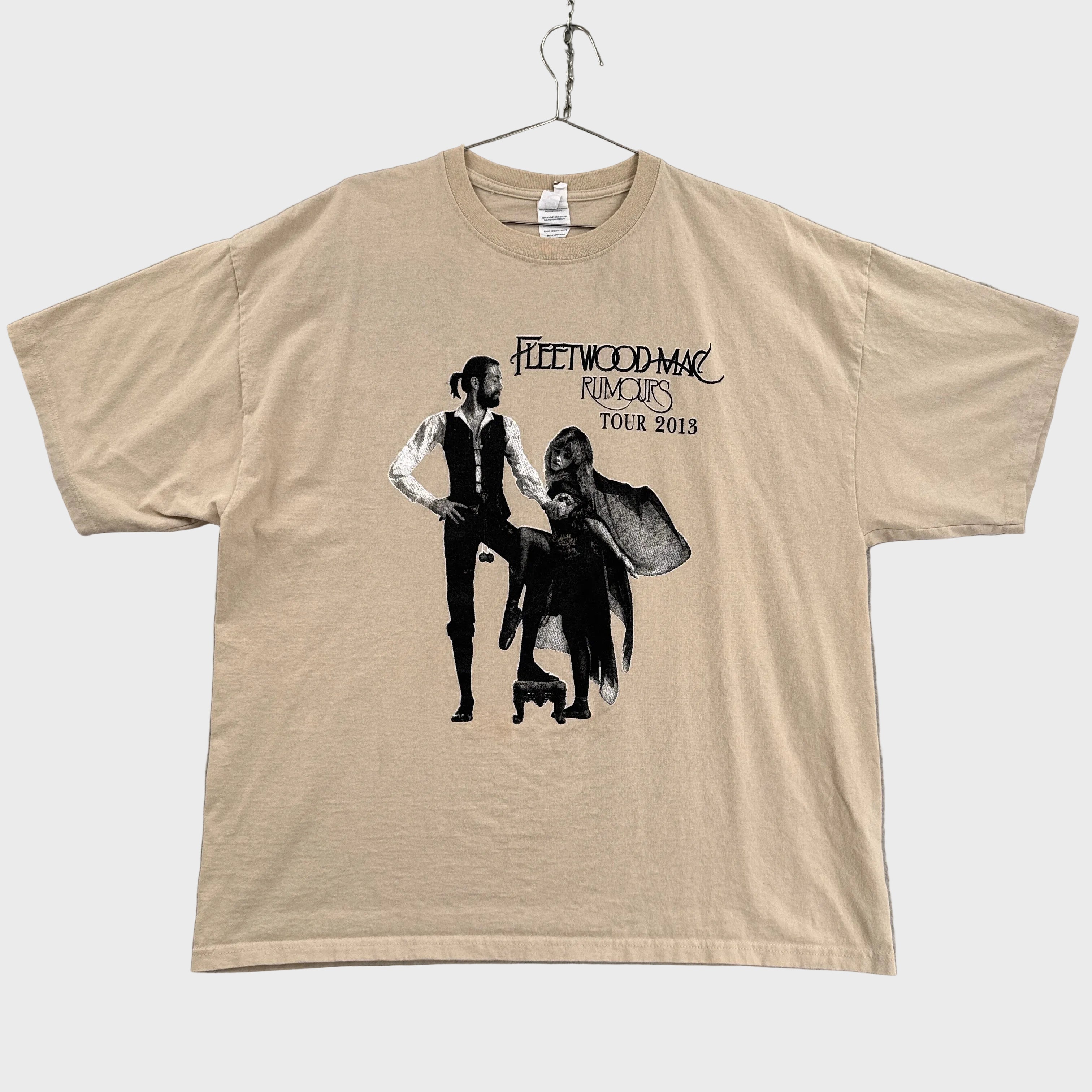 Beige t-shirt with Fleetwood Mac Rumours tour graphic on a gray background