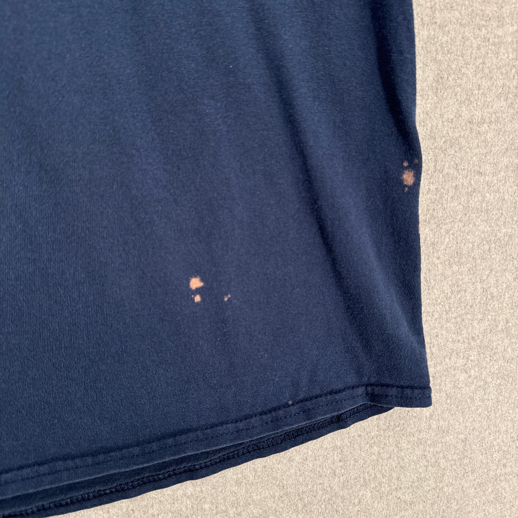 Navy blue fabric with stains on a beige background