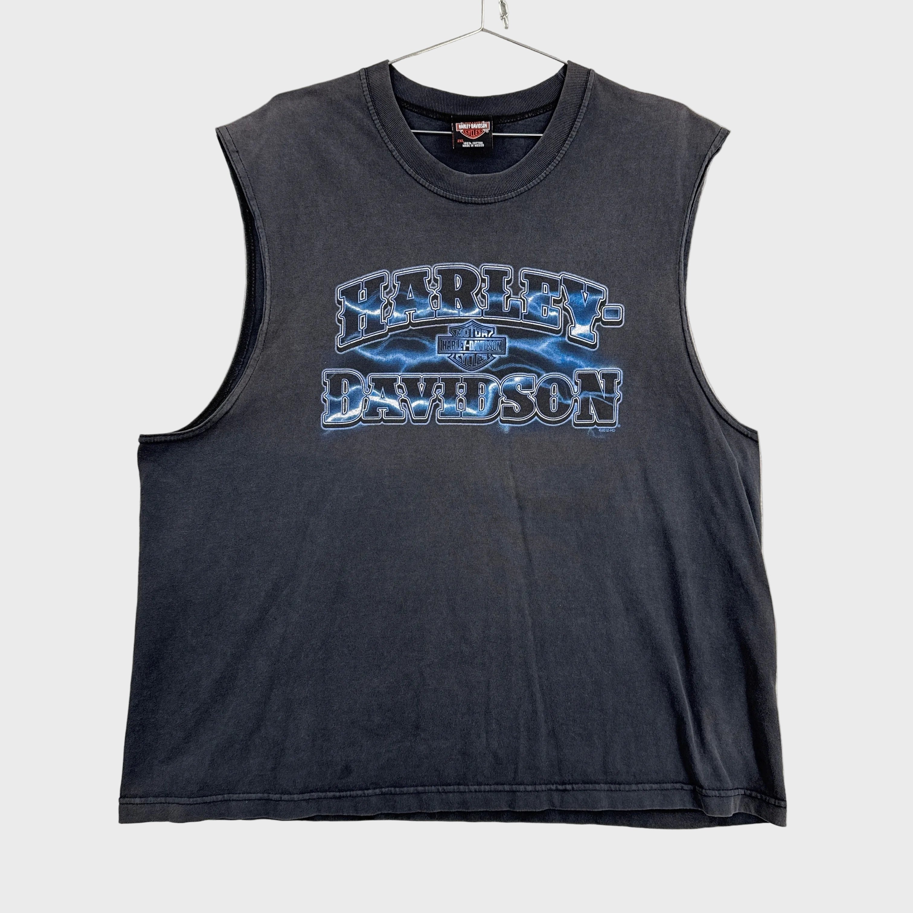Black sleeveless shirt with Harley Davidson logo on a gray background