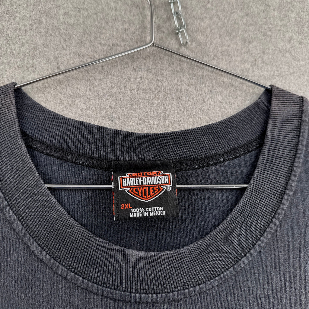 Harley Davidson label on a gray sweatshirt with a hanger in the background. Size 2XL