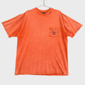 Orange t-shirt with a harley davidson pocket logo on a gray background