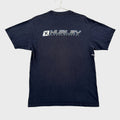 A dark navy blue short-sleeve t-shirt laid flat on a light gray textured surface. The back of the shirt features a vertical graphic print of the Hurley brand name in white and gray.