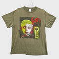 Green t-shirt with Korn graphic design on a textured white background