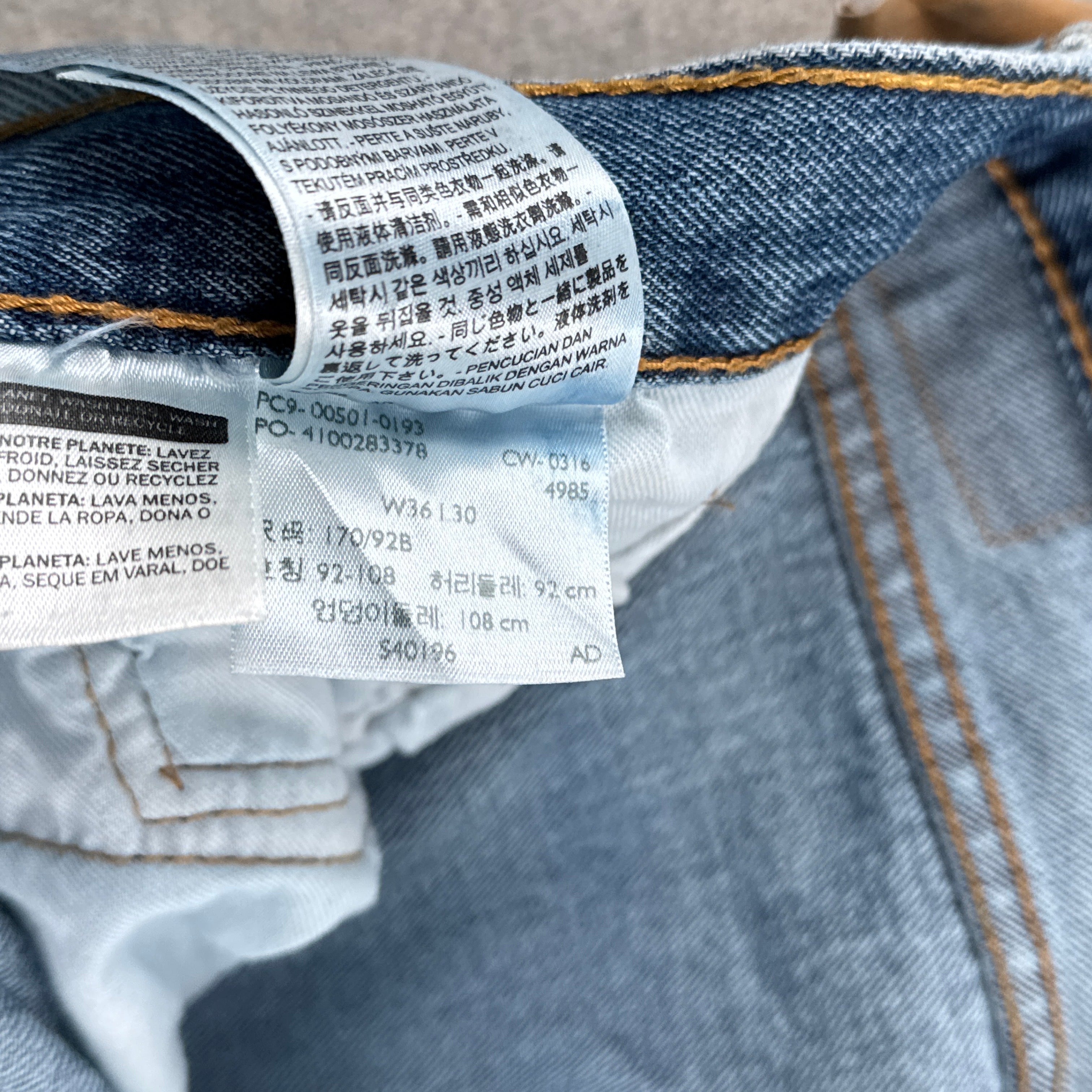 Close-up of a denim fabric with a label on a jeans background