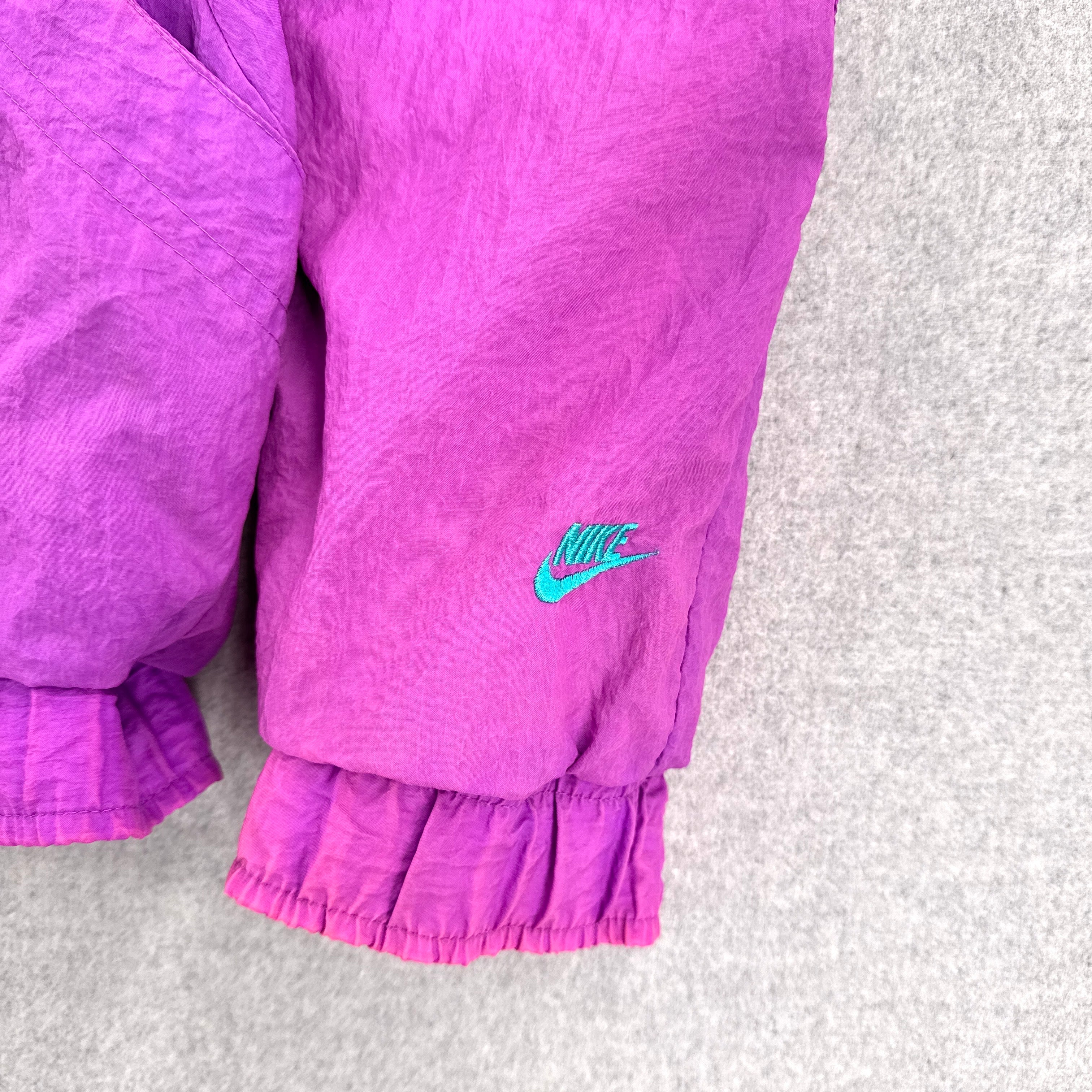 Purple Nike sleeve on a light gray background