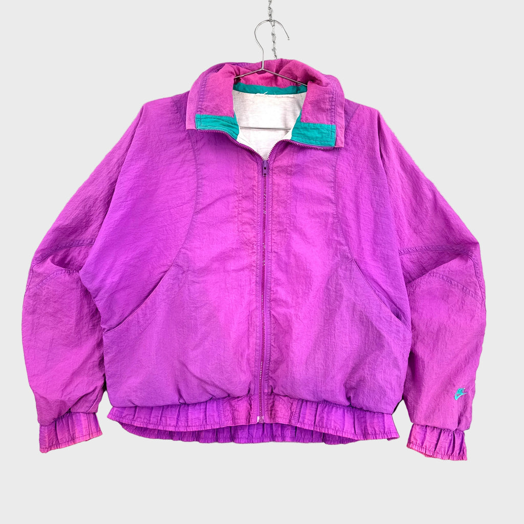 Pink/Purple winbreaker jacket with green trim on a hanger against a gray background