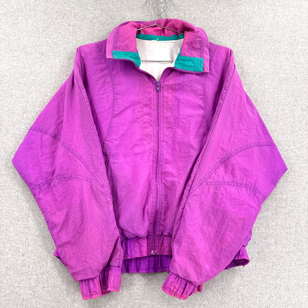 Purple jacket with green lining on a gray background