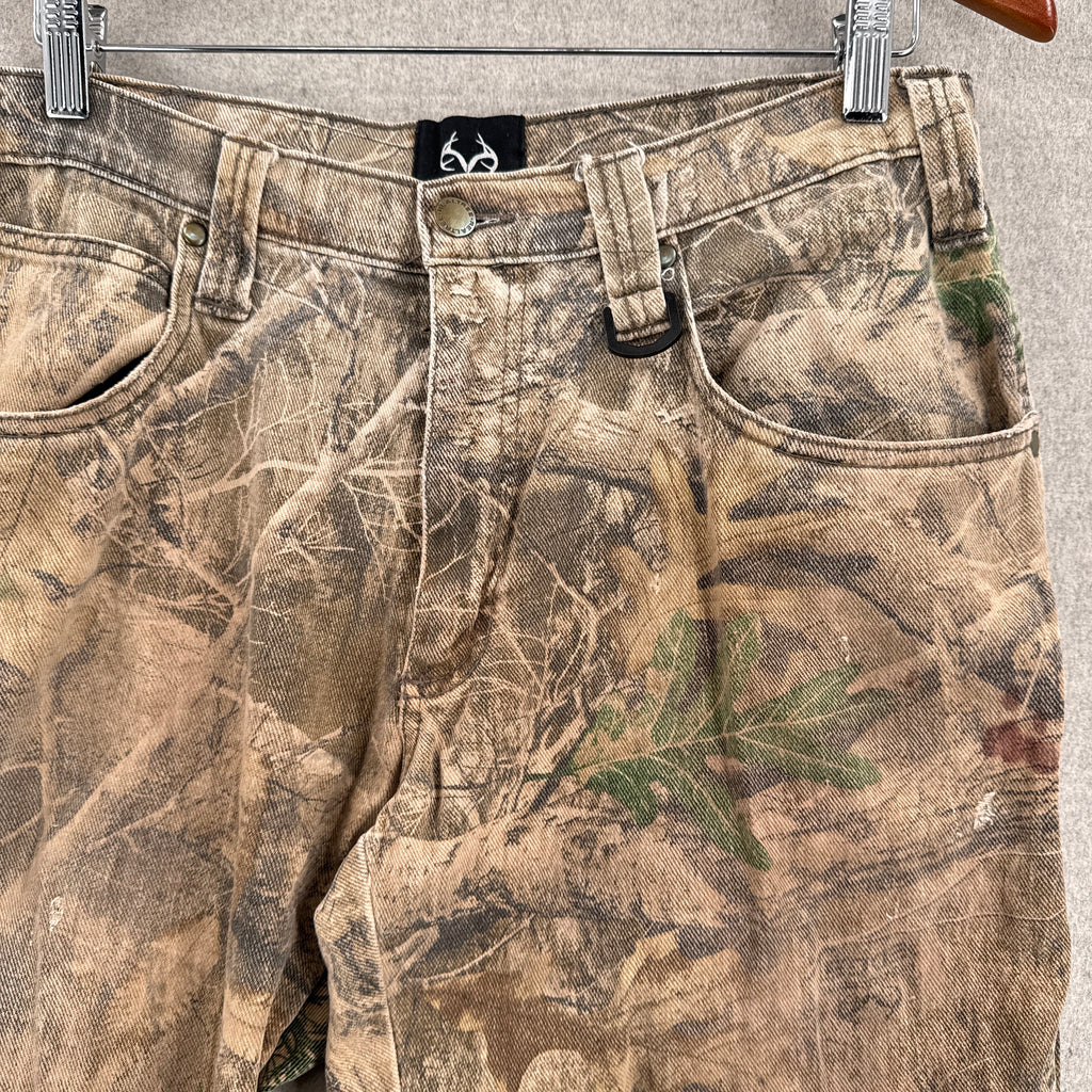 Camouflage pants with a brand logo on a gray background