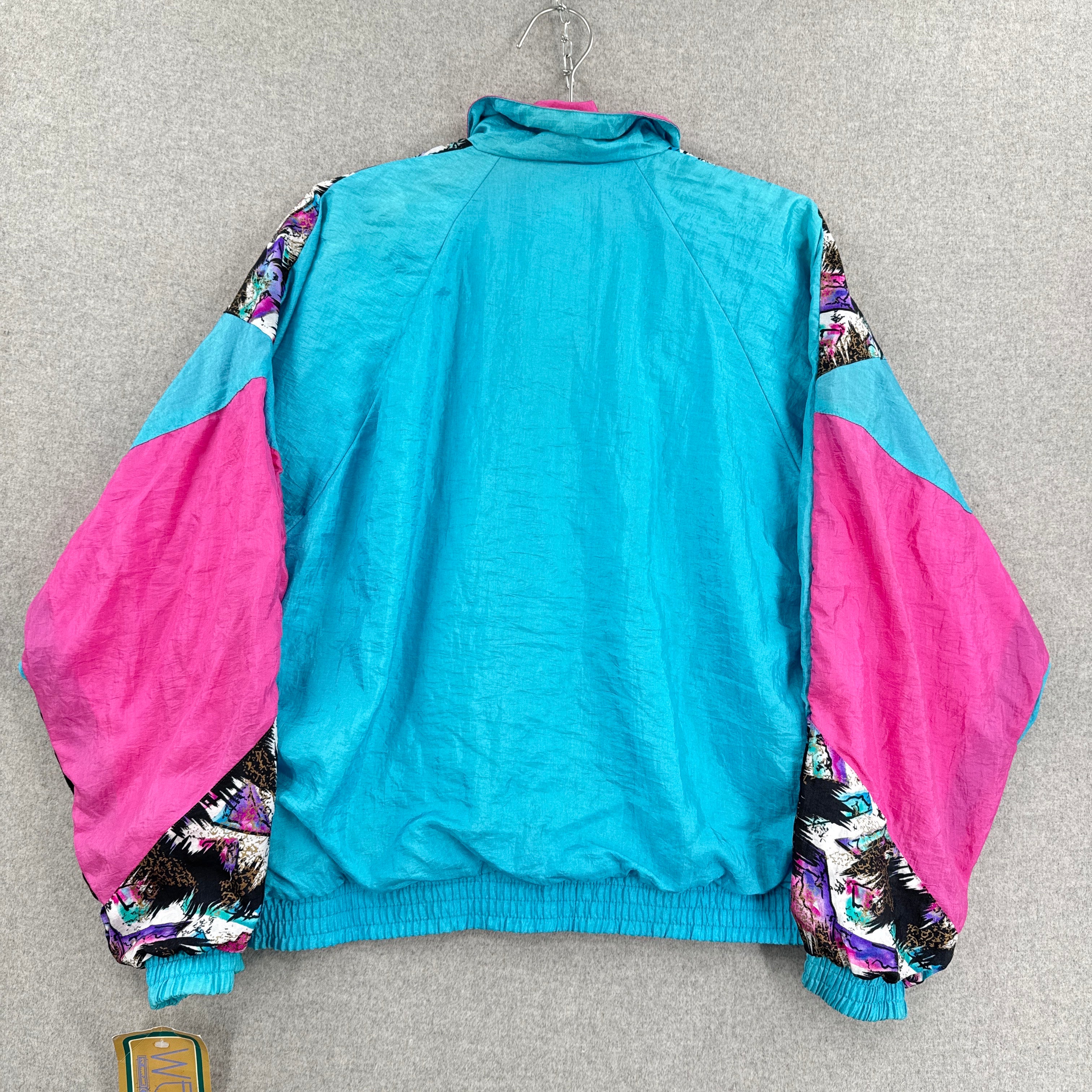 Colorful jacket with pink and blue sections on a gray surface