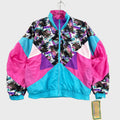 Colorful neon retro windbreaker jacket with geometric pattern on a gray surface