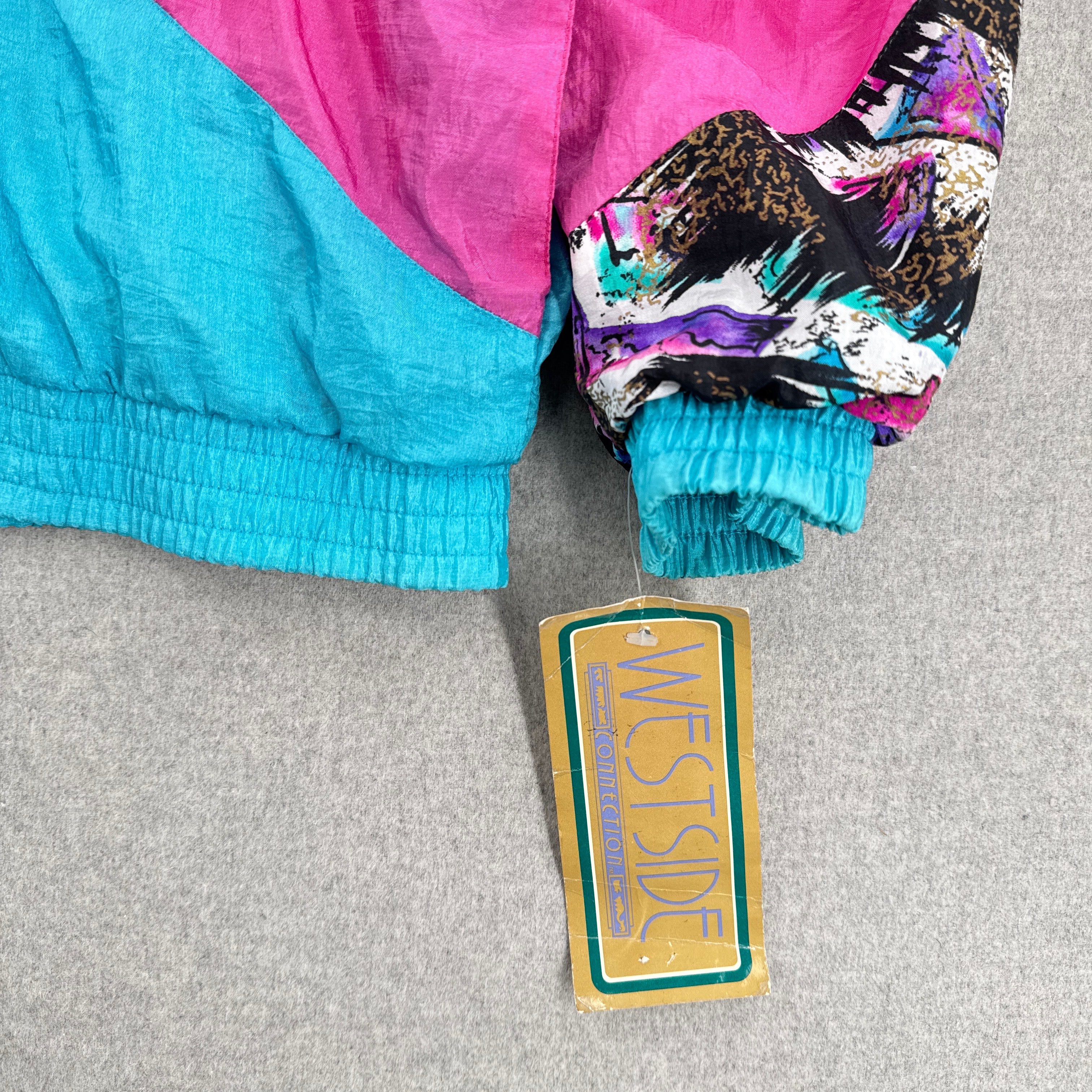 Colorful jacket with a 'Westside' tag on a gray surface