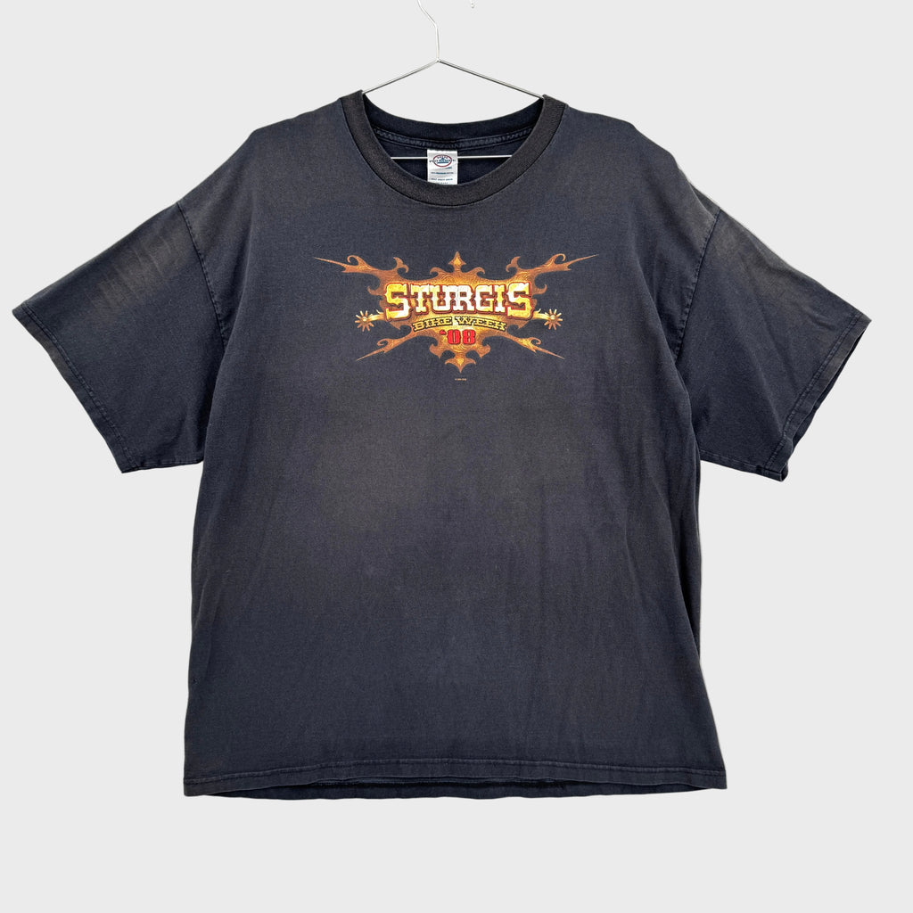 Black t-shirt with 'Sturgis bike week' graphic design on a gray textured background