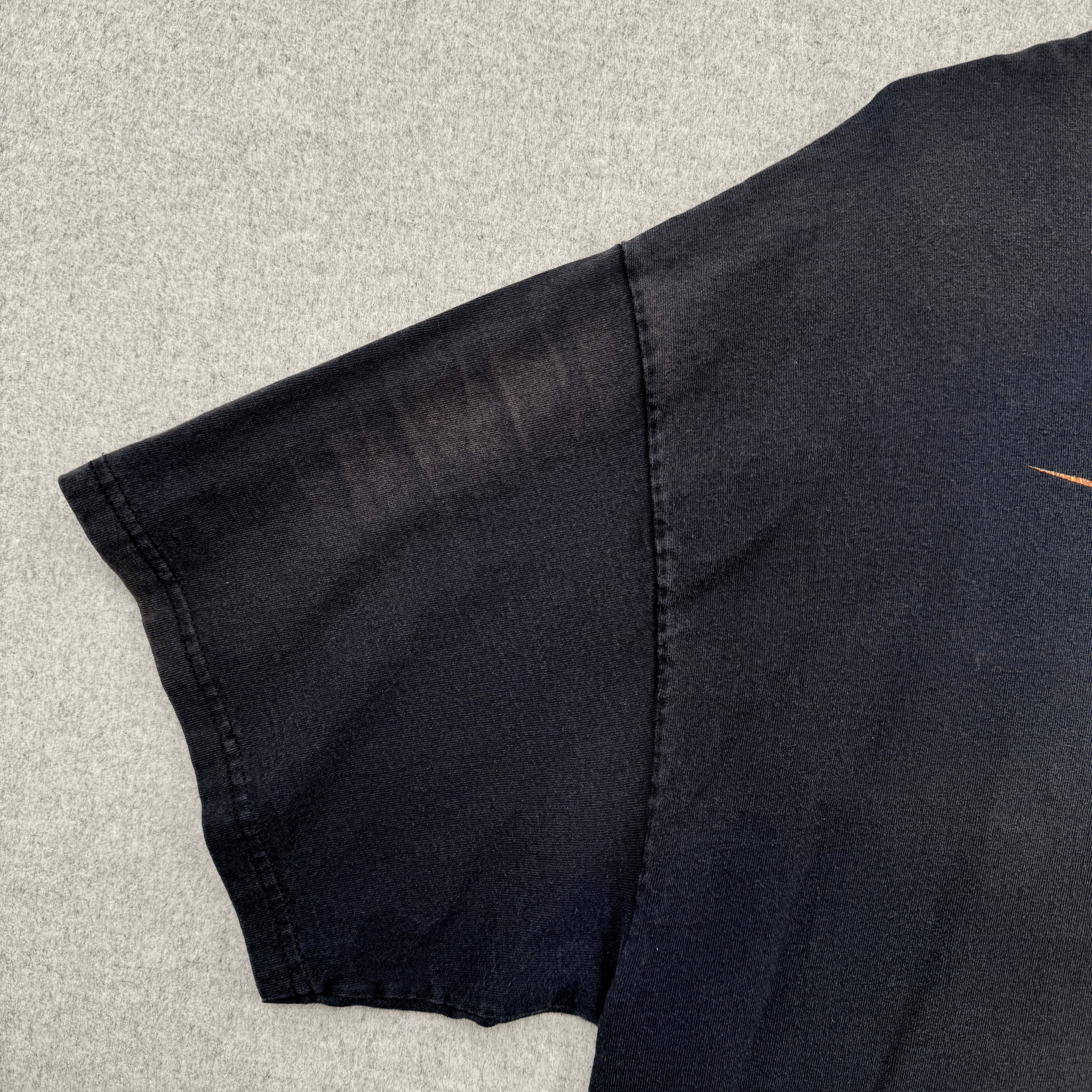 faded discolouration on sleeve of shirt