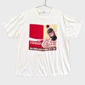 White t-shirt with Vanilla Coke graphic on a gray background