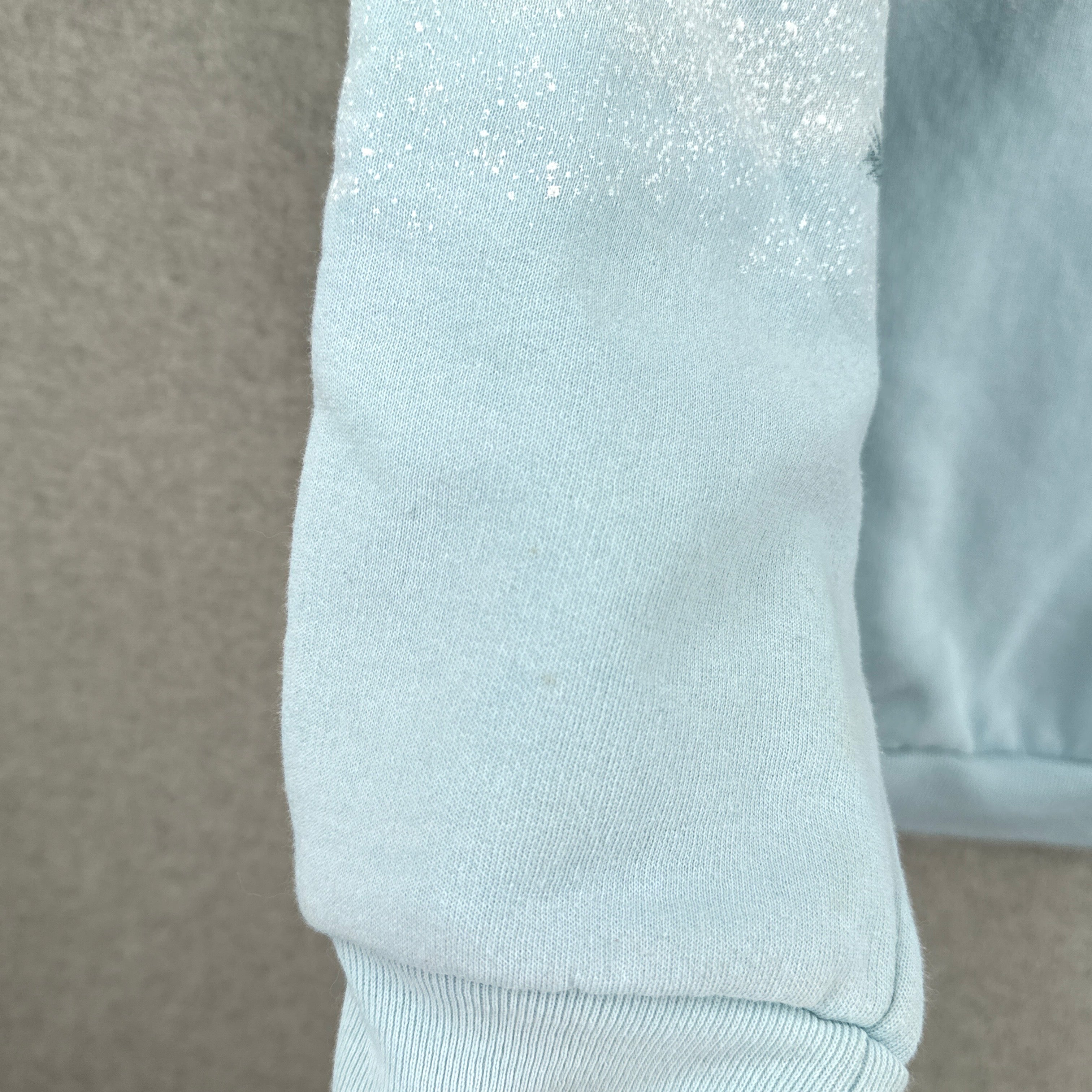 sleeve showing tiny stain spot