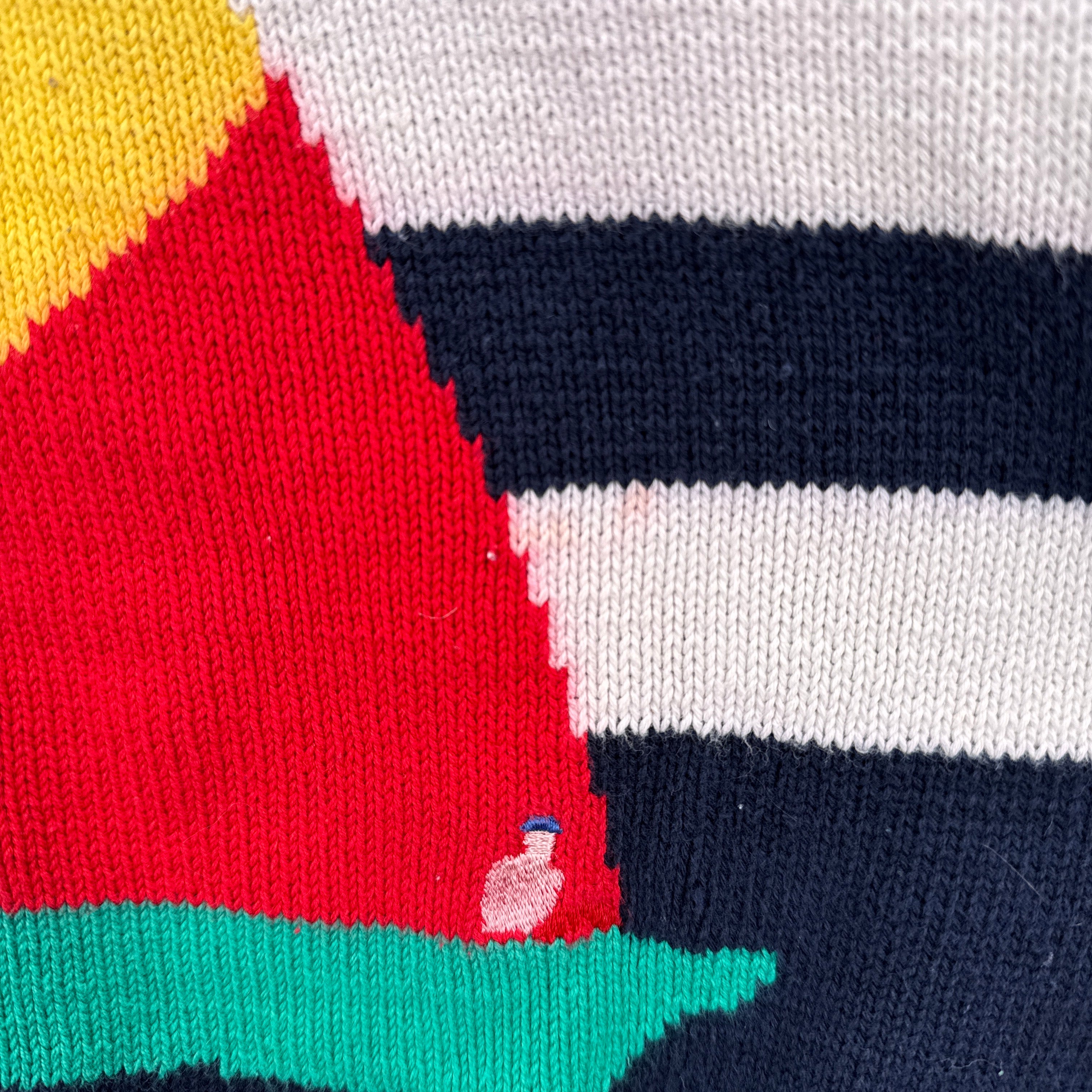 close up of small red ink spot on white stripe