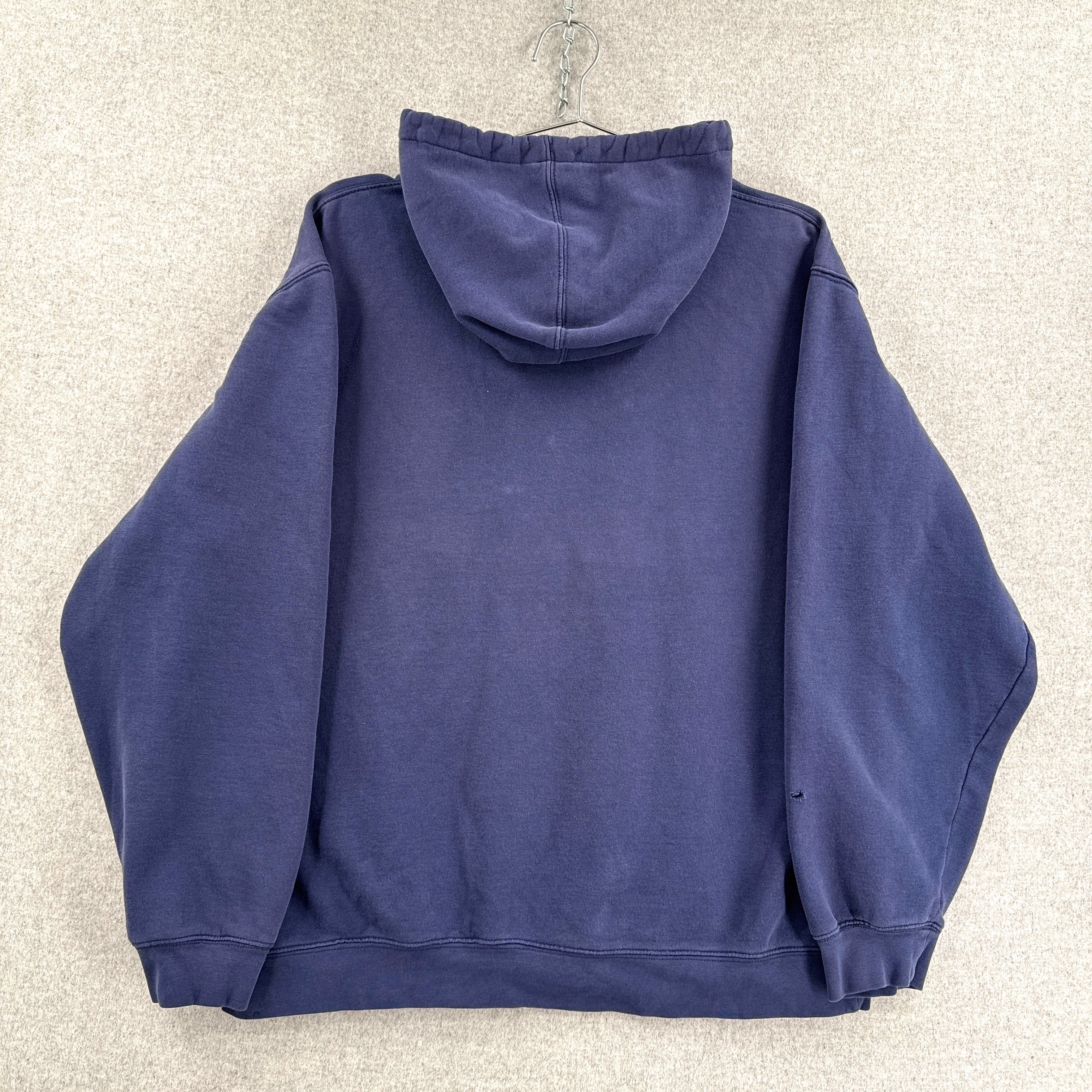 Navy blue hoodie on a beige background back of sweatshirt