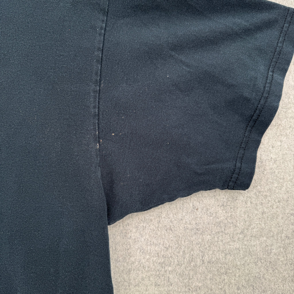 close up of the sleeve/armpit area. shows a few small stain spots